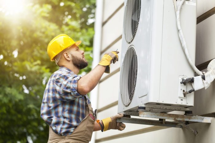 Premium Photo | Asian technician man installing an air conditioning in ...